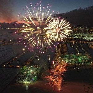 fireworks in the sky over a body of water