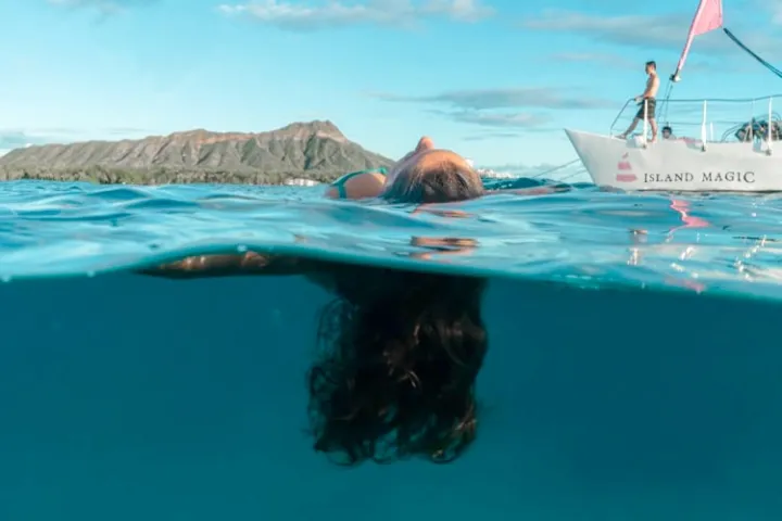 a person swimming in a pool of water