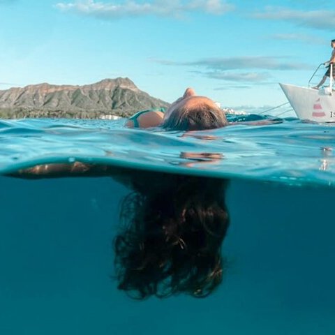 a person swimming in a pool of water