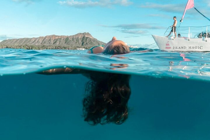 a person swimming in a pool of water