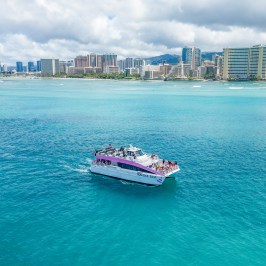 a large body of water with a city in the background