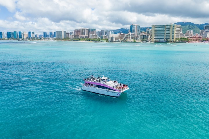a large body of water with a city in the background