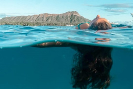 a person swimming in a pool of water